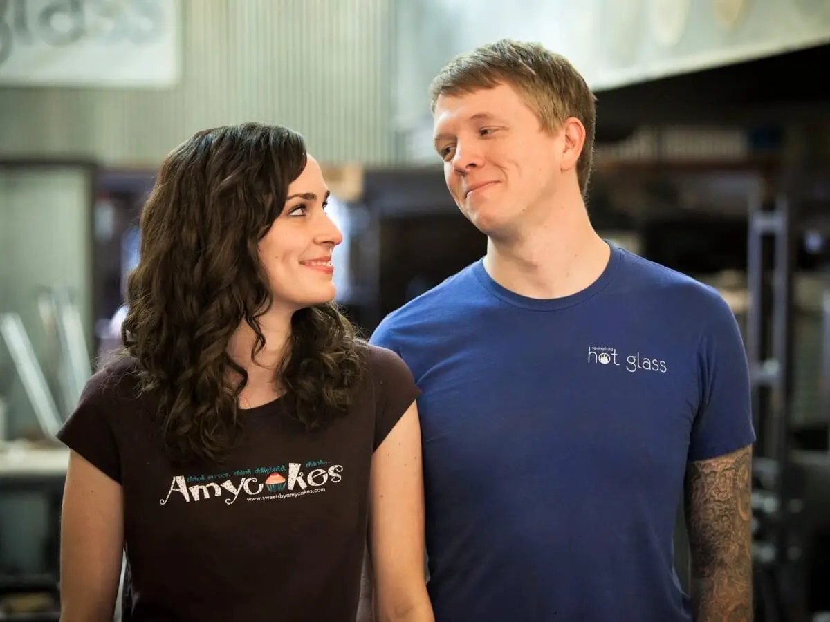 amy with an amycakes shirt on and Gabe with a Hot Glass shirt on