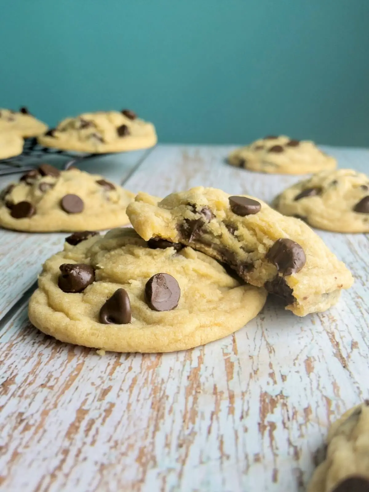A close up of very soft and chewy chocolate chip cookies on a table