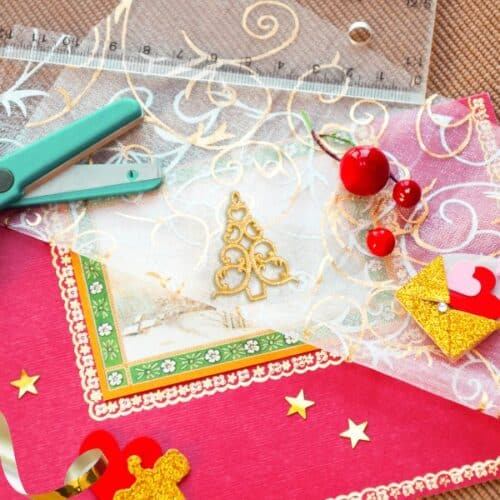 Festive scrapbooking supplies and Christmas paper.