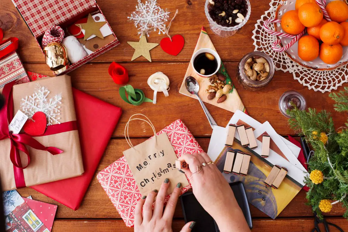 Gift wrap being customized with stamps.