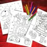 Three Printable Christmas Coloring Pages on a red background with some crayons