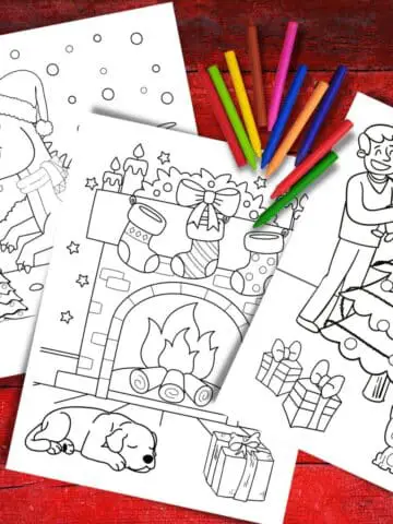 Three Printable Christmas Coloring Pages on a red background with some crayons